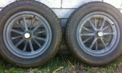A pair of 12 spoke Magnesium American Racing spindle mount wheels with tires, 15x3, early Ford bearings.
A pair of Magnesium Halibrand big window wheels, 15 x 12, 5 on 5 bolt pattern, Olds/Pontiac/ and some late GM. These wheels are in excellent shape,