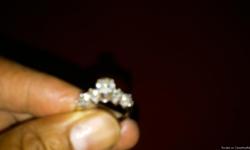 Im selling a beautiful lady's 14k white gold diamond ring .50 center diamond with four .25 side diamonds two on each side of the center. Size 9 or u can get this ring sized to fit. This ring is breath taking a must see to appreciate. Pictures does not do