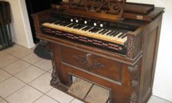 Works.&nbsp; Very ornate.&nbsp; Solid beautiful Mohagany, with REAL ivory keys.&nbsp; 41 inches wide.&nbsp; 1887 date stamped inside.&nbsp; --