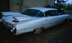 1959 Cadillac. Very straight. minor rust. Chrome good. Glass good besides cracks in drivers and passengers window. Did run and drive. 2 hoods both in good condition. 86,000 miles. Interior shot. Power windows.