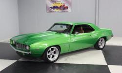 Stk#062 1969 Chevy Camaro SS Painted Synergy Green BC/CC that is beautiful, straight and slick. The front & rear bumpers are nice as well as the door handles. This '69 has dual outside mirrors, antenna on the fender all of which are nice. Like new steel