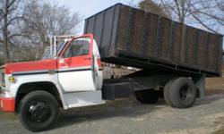 1974 Chevy 2/Ton Dump Truck, G.V.W.R. (gross vehicle weight rating) 19,000 lbs., 350 Chevy engine, 4 speed transmission with a 2 speed axle, pto driven dump bed with wood side boards grain body and tailgate, trailer hitch for a drop/hitch pin, electric