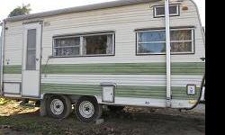An Oldie but a Goodie. 19' Fully self contained. Stove, Oven, Refrigerator, Shower. Lots of Storage. Open to trade.