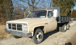 1985 GMC 3500 dump. This was a State park truck and only has 62,000 miles on it. It has a 350 motor, 4 speed transmission, power steering. The bed is 8? all steel Knapheide electric over hydraulic flat bed with removable sides. This is a great older truck