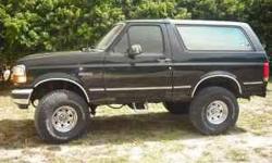 This is a 1992 Ford Bronco XLT with a 5.7L (351) V8 and an automatic transmission. This truck is black with dark grey leather interior and has 154K miles.
This Bronco has a 4 inch super lift, 35 inch tires and CARR steps on each side. The tires are