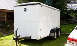 Wells Cargo enclosed trailer, tandem 3500 lb axles, electric brakes, spare tire.