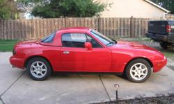 1994 mazda miata. soft/hard top convertible. soft top is black. hard top red. interior black. manual shift. 115,500 miles.