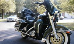 1997 Harley-Ultra Classic Electic Glide, mint condition, low mileage, garage kept, custom chrome wheels, AM/FM sound system, CB system, new tires, all Harley dealer service history, custom rear and side travel bags, dark green with black trim.