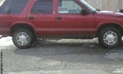Red 4door, with hatchback, 4wheel drive, drives and run good. Tires are less than 1 year old