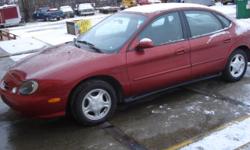 nice clean front wheel drive with snow tires 4door sedan red taurus se 1999 low miles very very great deal
