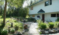New Price this Alaskan Retreat, has 3 bedrooms, 3.5 baths, 700 s/f 2 car garage and sits on 1.4 acres of serenity. Woods are your view out every window you have a beautiful lawn and garden in summer with cascading waterfall and lots of sun in winter. New