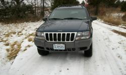 2001 Jeep Grand Cherokee Laredo. This jeep is very clean and has had the 4.0L engine rebuilt, also has a new starter, new front brakes and rotors, new tires and wheels, and new battery. Options are, power windows, power locks, automatic transmission, tile