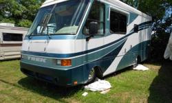 2001 Safari Trek Class A Motor Home 24', 2 awnings, generator, solar panel, basement storage, back up camera, sofa sleeper, queen bed, automatic leveling jacks, stove, microwave/convection oven, double sink, full bath includes glass enclosed shower,