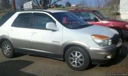 2-TONE WHITE AND TAN 2002 BUICK RENDEZVOUS AWD CXL. 110,xxx MILES. RECENTLY INSPECTED. MANY GREAT FEATURES LIKE: HEATED SEATS, ONSTAR CAPABILITY, 3RD ROW SEATING, RECLINING SEATS, POWER EVERYTHING, 3RD ROW SEATING CAN BE FOLDED DOWN FOR EXTRA TRUNK SPACE,
