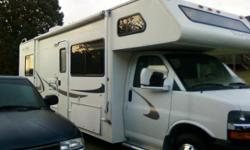 Class C motorhome **28 foot** CHEVY ** sleeps 6-8 * Rear queen bedroom * center kitchen * stove/oven * microwave * double door refridgerator and freezer uses propane or electric * jack-knife sofa * fully self contained with generator * rear ladder * rear