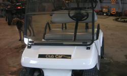 2004 gas golf car. Top, tinted shield, lights. White with gray seat. New 10'' aluminum wheels and tires.