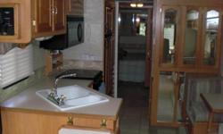 EXCELLENT CONDITION 35 FOOT MOTOR HOME, 2 SLIDES, FIREPLACE, WASHER/DRYER, 2 TV'S, QUEEN BED, SLEEP SOFA, REAR BACK UP CAMERA, ETC.