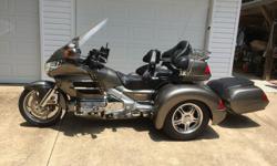 2004 Honda GL1800 Goldwing Trike. Trike and trailer are both Titanium color. 21504 miles. Champion trike kit. Extra's on trike include: CB;&nbsp; Ez steer with front fender extender; wind wings upper and lower; rear spoiler with LED back off lights;
