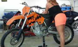 This is a 2004 KTM 450 SX four stroke dirt bike. It is a nice bike. Never raced only trail ridden. Bike runs strong. Has a new rear fender. TIres are about 75 percent. Chain and sprockets are good. No broken plastic. Excel wheels. Call or text --.
