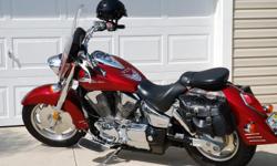 " Candy Red beauty ", runs like brand new, has saddle bags, Memphis windshield with bag, throttle lock, FRESH MAJOR TUNE_UP, including oil and filters all done in Feb. 2011, tires and battery almost new, garage kept, no damage, less than 11,000 miles, no
