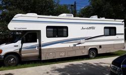 With only 12,000 original miles,this coach is built on a Ford chassis and powered by a Ford 6.8L V10 Engine, like new, and everything in very good condition. Oven, Spare tire,all new tires, Refrigerator, TV above Cockpit, and Pass Through Storage. The