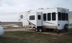 Fifth wheel travel trailer. Two sliders. Many extras!!