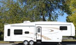 GREAT CONDITION. No smoking, no pets, no children; VERY CLEAN. Fiberglass exterior. Enclosed, insulated, and heated underbelly. Heated sub-floor and tanks. Length: 33' 10". UVW - 10,837. GVWR: 13,850. 3 slide outs. KING SIZED BED with pillow top. Large