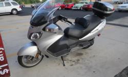 Advertising for a good friend: 2005 Suzuki Bergman 650cc Luxery Scooter. Senior owned and excellent top condition. Large windshield and matching travel trunk Excellent transportation with lots of storage and fun to ride. New rear tire and serviced.