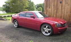 2006 Dodge Charger RT with all the options, heated leather, tinted windows, great sound system, performance pipes, Hemi 5.7.. Fun and fast red car that I get compliments on all the time. It has low profile tires with chrome wheels, rear spoiler, 6cd
