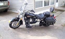 2006 Harley Davidson Heritage Softail Classic. It is in very good condition with 13400 miles. Has Reinhart racing exhaust and leather saddlebags