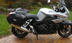 2007 BMW K1200 R Sport. Has small fairing and gearing inbetween S and R, which makes it perfect for all around. Excellent
sport tourer that is lighter than most and handles well. It will do 175 mph with luggage, according to the speedometer. Only selling