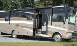This motorhome is a 34 Class A RV with 11,118 miles. It sleeps 6. With a Ford V-10 Engine, generator and 2 roof A/C's; this motorhome also has automatic hydraulic leveling jacks, tilt steering, cruise control, rear vision camera/monitor, heated power