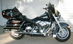 Black with blue and silver pinstripes.&nbsp; Heated grips, cruise control, radio, CB, Weatherband, CD player, driver's backrest, lots of chrome and extras.&nbsp; Great condition, ready to ride.&nbsp; Always garaged.&nbsp; 1584 cc engine. 27,500 miles.