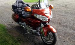 2007 Honda Goldwing.... which has been meticuously maintained. This bike has everything.... Including Navigation, trailer hitch (never even used) heated grips and seat, back rest, cup holders for rider and passenger, Trailer hitch for storage bag (never