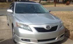 I am selling a 2007 toyota Camry SE with 165xxx miles on it. It has black and silver cloth interior. The interior is in perfect condition. It has sunroof, fog lights, and all power options. It comes with 6 CD changer and a Bluetooth system. The car is in