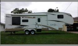 This is a 34ft Fifth Wheel with rear living room and 2 slides. Very Nice! Well taken care of. Great Deal. Must Sell. This is a nice model, it is ranked 12 out of 396 in RVGuide.com The NADA avg price for this model is $21K. We want to make a deal and sell
