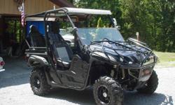 2008 Special Edition Yamaha Rhino 700 4x4 ( for $2900 ) that has been custom built to accommodate family cruises in a safe and secure way. With only 900 miles this Rhino has no scratches. scrapes, bends, or breaks. It is in most excellent condition. for