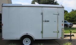 2009 7x14 Carry-On Enclosed Trailer with side door & rear drop down door, vented, interior lights. Has shelf, hooks, bins & interior tie-downs installed. Ramp has been reinforced for stability. Like new condition. (Tools & equipment shown ARE NOT