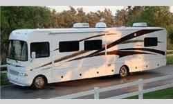 Double Slides Class A Motorhome w/rear bedroom. Fully walk around Queen Bed with Nightstands, Closets, 20" TV w/DVD. Stacked Washer and Dryer, shower, Private Toilet Area w/ Lav. Amana full size refrigerator, Amana full size 4 burner gas stove. Amana 1000