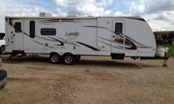 2010 Laredo by Keystone. Purchased new on 9-25-2012. 30 Ft. Long with two slide outs. Comes with shower, bathroom, bedroom, living room/kitchen (includes gas oven/stove, microwave, fridge, couch, chairs+table and slide out TV). Please call for inquiries.