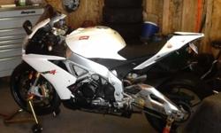 2012 Aprilia RSV4R 40 championships edition white with 1957 miles...
Race inspired 180 + HP 65 degree V4, quick change cassette type 6 speed gearbox, Brembo brakes...
All accessories installed at dealership to include.
Ecu unlocked and Aprilia / akrapovic