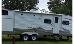 2012 Layton Joey 29.5 feet,inside and outside full kitchen,electric awning,1slide, transferable extended warranty covered until July 2018,heated queen bed and 3 bunks,comes with hitch and sway bar ,many more extras