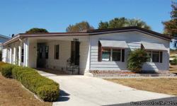 Beautiful 2 bedroom 2 bath 1248 sq. ft. manufactured home in Rolling Greens golf community. This wonderful home includes a dishwasher, glass top stove, refrigerator, disposal and has ceiling fans throughout the house. The living room, dinning room and