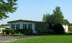 24' x 50' Furnished Manufactured Home......55+Golf Community (80/20)......A two bedroom, 2 bath mobile home with large lot for sale in quiet neighborhood in Ocala, Florida....Home located in Rolling Greens Manufactured Home Community....The community