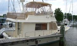 The Mainship 34 Sedan is one of the most popular small cruisers ever built. She constructed on a fiberglass semi-displacement hull design with a fine bow entry and a full-length keel below. First of the Mainship series, the appeal of the 34 Sedan had much