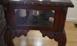 Oversized coffee table with 4 drawers; 2 matching glass cabinet end tables. In excellant condition.