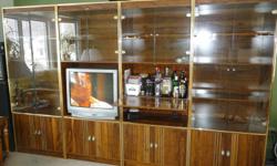 4 piece wall unit.......all pieces light up.......can be used side by side or seperated into individual pieces......each piece is 76 high by30 wide.......it now holds a 27" tv.......has a drop down cabnet we now use as a bar.....in Great Condition