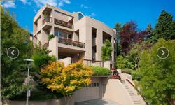 Exquisite, one of a kind home in Laurelhurst: Private terraces on each level (8) all with exceptional Lake Washington, Mt Rainer and Cascade vistas framing incredible painted skies. Elegant Asian garden. Open living rooms with floor to ceiling windows