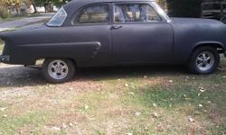 53 Ford 2 door custom line,, charcoal exterior Brown interior,, 5.0 Mustang motor with berg Warner T10 4 speed with Hurst, complete new dual exhaust front to back Flowmaster,, craigers with new tires,,, new radiator water pump alternator all new