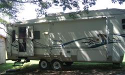 2003 Cougar, 5th Wheel,(29.5 ft) can sleep 6 people., 5th Wheel Hitch included. Slide out in Kitchen and setting area. Big TV cabinet included. Lots of storage in Kitchen and setting area. Fold away bed in couch, 1 Bath and separate big shower with glass